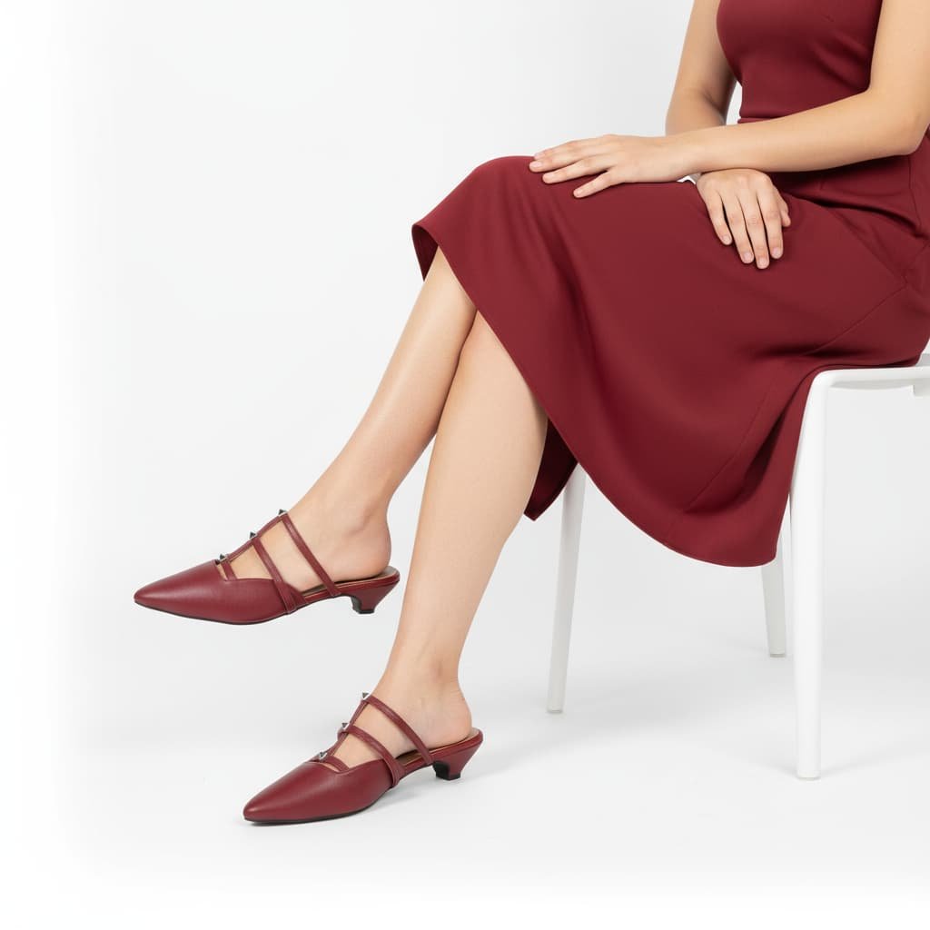 Model View Red pointed-toe women’s flat with triple straps and metallic stud detailing – Two Solez Ruby Vibes.